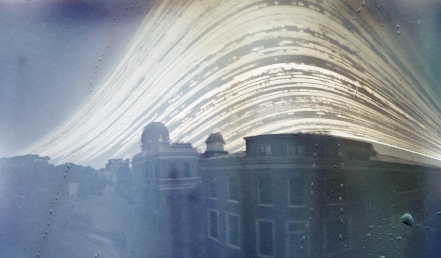 SolarCan pinhole image taken from June 2022 to December 2022 in Leiden, The Netherlands, showing the Old Observatory building and domes with the passage of the Sun behind the buildings.
